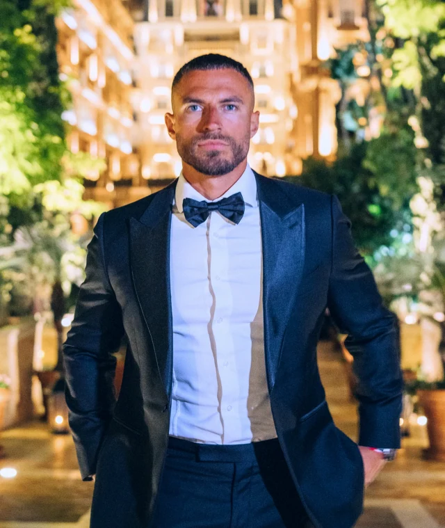 Mike Thurston wearing a dark tuxedo and bow tie.